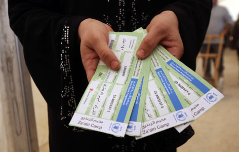 Ruokakuponkeja, joita jaetaan Za'atarin pakolaisleirillä Jordaniassa. Kuva: Salah Malkawi.